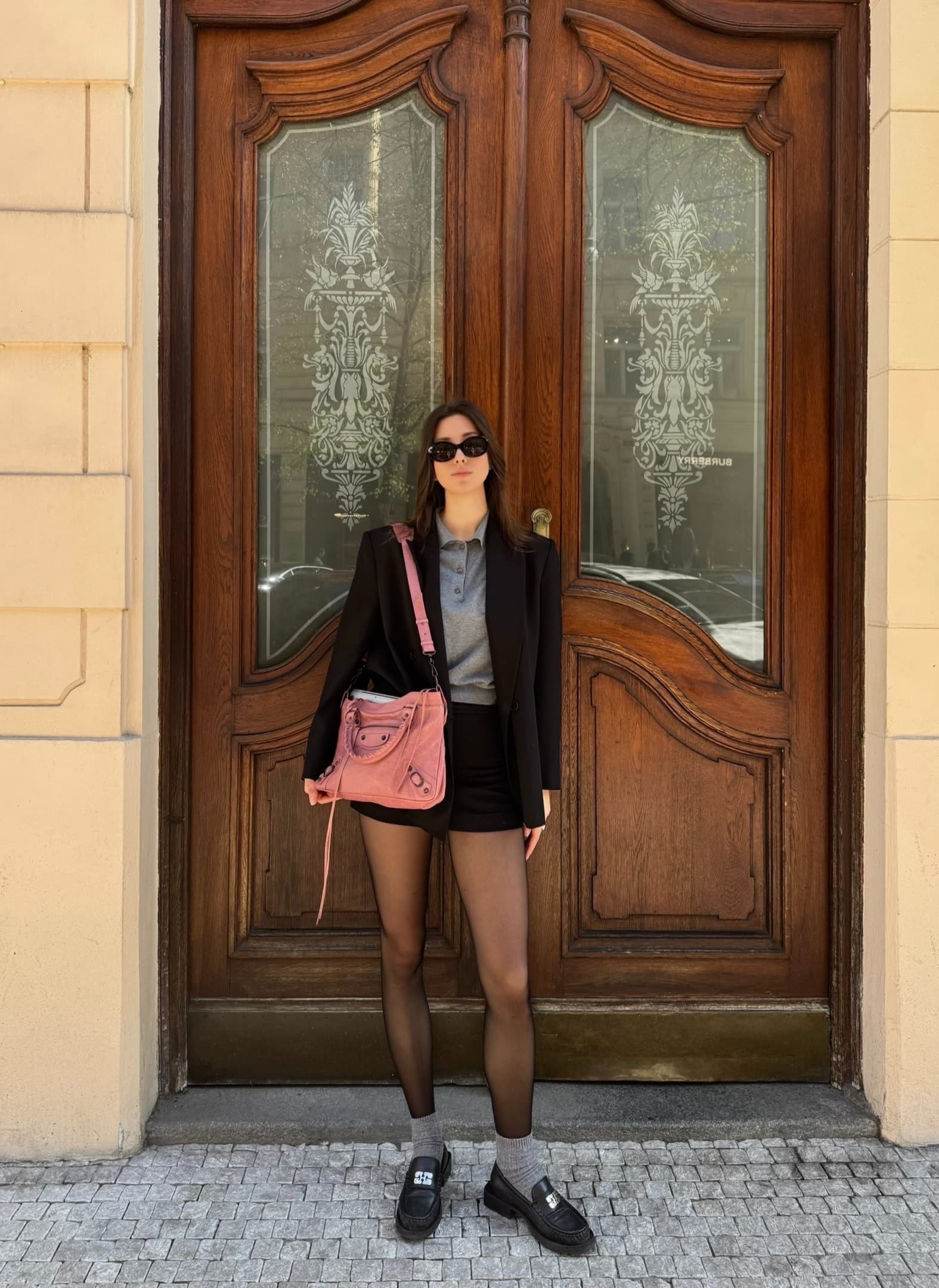 A Luxy Vintage customer carrying a designer bag